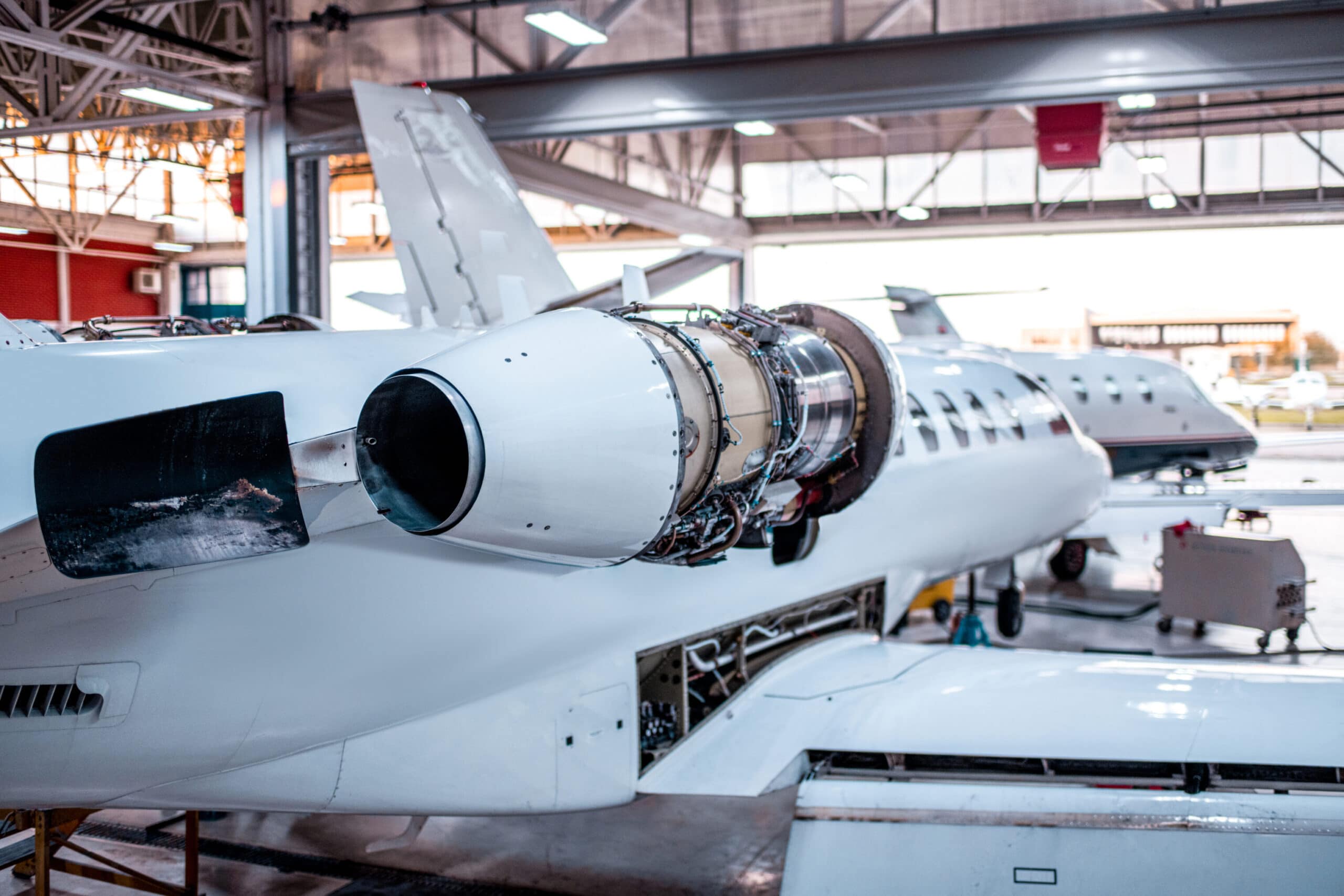 Citation Jet in hangar for maintenance with engine cover removed