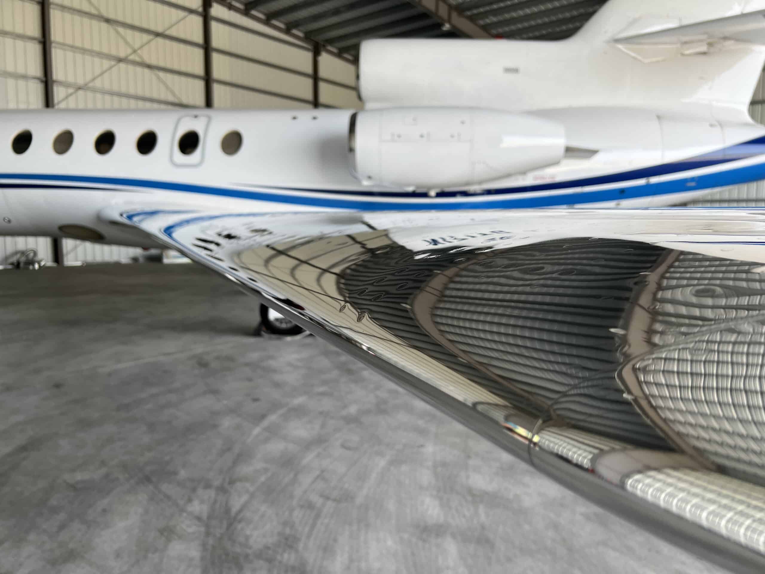 The finished result of aircraft maintenance services on the wing of a private jet.