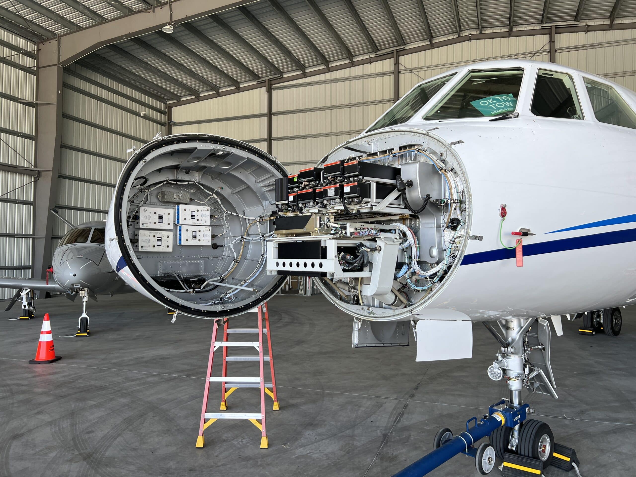 work in progress of repairs on the avionics system of a private jet